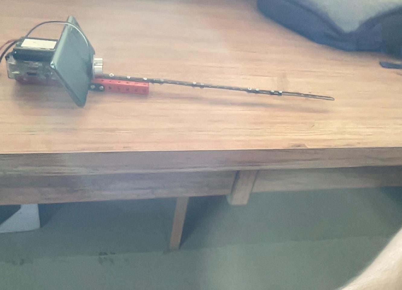 Navi-Netra physical prototype with smartphone mount and ultrasonic sensors